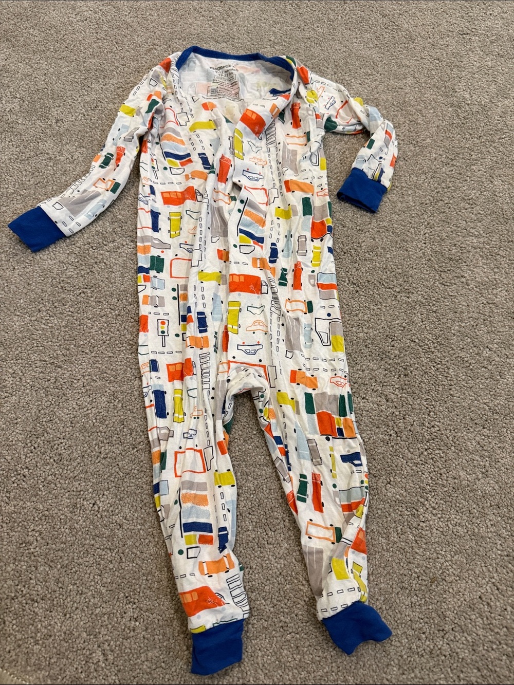Magnetic Me White Footed One-Piece with Blue Trim and Colorful Vehicle Print